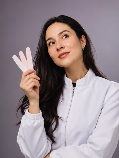 The founder of Harmony Beauty Lab holding nail files